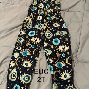 Posh Peanut Navy and Gold Eye Print Jumpsuit